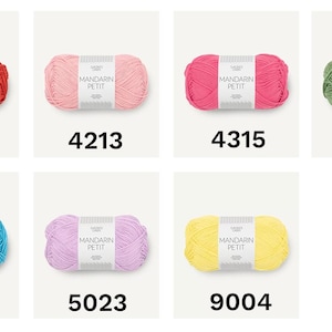 May include: A collection of colorful yarn skeins, each labeled with a unique number. The yarn is available in various shades, including red, pink, green, blue, purple, and yellow. The label reads "MANDARIN PETIT".