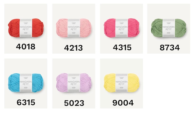 May include: A collection of colorful yarn skeins, each labeled with a unique number. The yarn is available in various shades, including red, pink, green, blue, purple, and yellow. The label reads "MANDARIN PETIT".