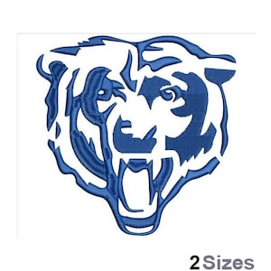 May include: Blue embroidered design of a bear's head with an open mouth and sharp teeth.