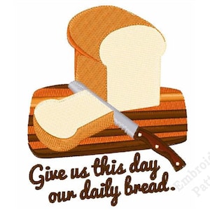 May include: An embroidery design featuring a loaf of white bread with a golden brown crust, a single slice of bread, and a serrated knife on a wooden cutting board. The text "Give us this day our daily bread." is embroidered in brown below the board.