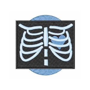 May include: An embroidered patch with a blue heart inside a white ribcage on a black background. The patch is surrounded by a light blue circle.