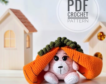May include: A handmade pink crochet bunny with orange carrot ears and green leafy top. The bunny has black eyes and white accents. The image includes the text "PDF CROCHET PATTERN" in a white circle.
