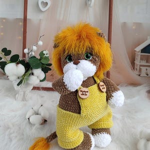 Amigurumi lion crochet pattern. Lion cub with clothes