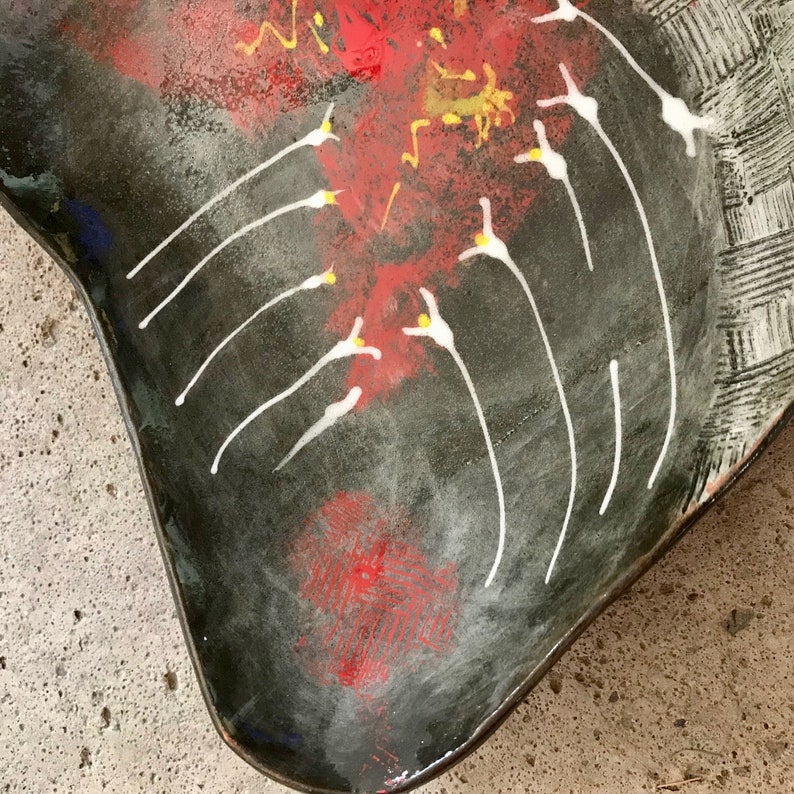ceramic fruit dish artsy in black clay with modern painting in red white and yellow