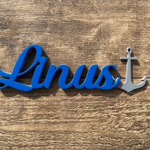 Schriftzug mit Anker aus Holz