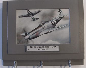 Wall Mounted Keychain Rack with a 4"X6" print of a painting of a North American P-51D Mustang in a dogfight with a German aircraft.