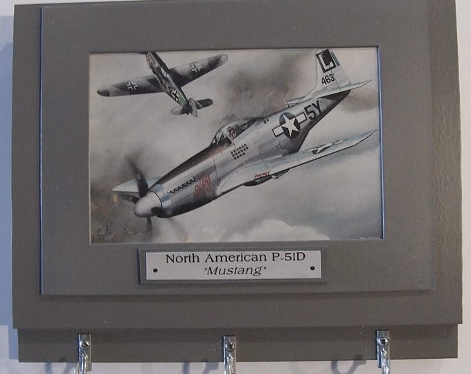 Wall Mounted Keychain Rack with a 4"X6" print of a painting of a North American P-51D Mustang in a dogfight with a German aircraft.