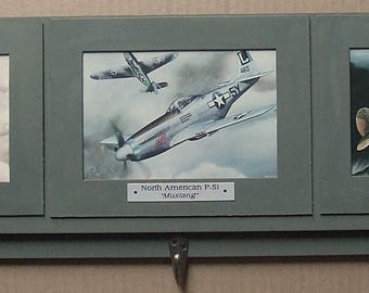 These 4"X6" prints of paintings of three of the most famous U.S. military WWII Warbirds are mounted on a 24" Keychain Display Rack