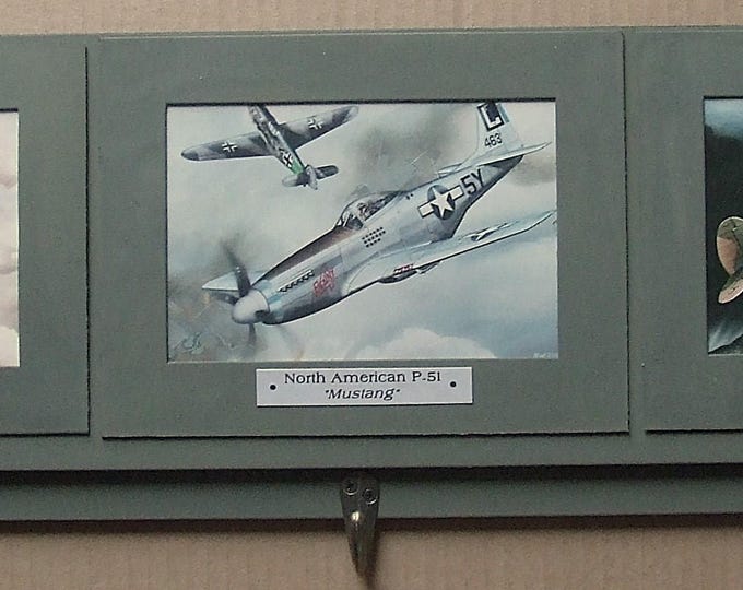 These 4"X6" prints of paintings of three of the most famous U.S. military WWII Warbirds are mounted on a 24" Keychain Display Rack