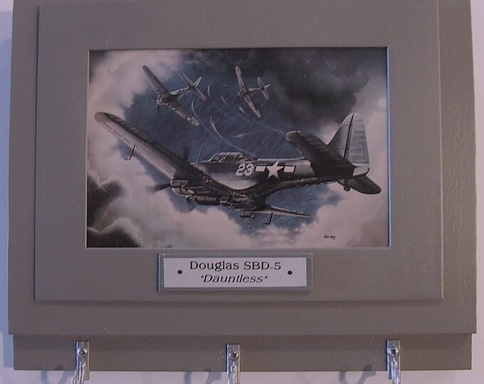 Wall Mounted Keychain Rack with a print of a painting of a Douglas "Dauntless" diver bomber preparing to strike.