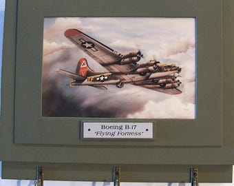 Wall Mounted Keychain Rack with a 4"X6" print of a painting of a Boeing B-17 Flying Fortress on a bombing mission over Germany during WWII.