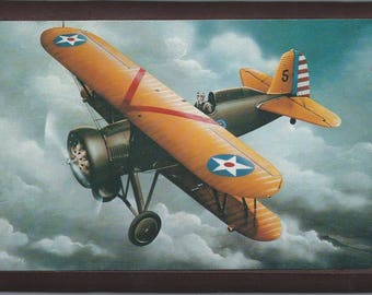 Framed 4" X 6" painting of a Boeing P-12E WWI Pursuit aircraft.  Designed to hang on a wall or can be displayed on a shelf or desk.