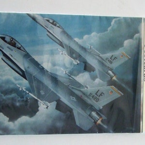 Un paquet de cartes postales Mini-Poster d’avion classique de 4 » X 6 ».  Le paquet contient 10 avions différents.