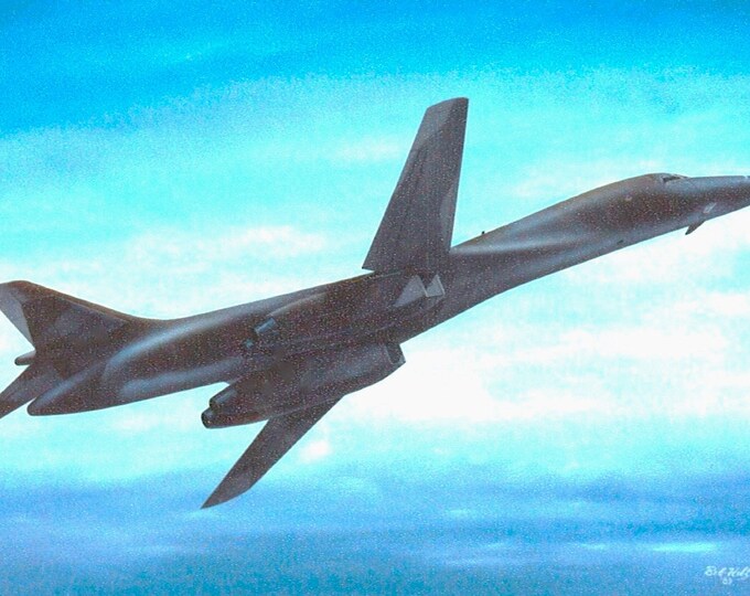 Framed 4" X 6" Print of a painting of a USAF Rockwell B-1 "Lancer" supersonic bomber.  Made to hang on a wall or display on a shelf or desk.