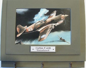 Wall Mounted Keychain Rack with a 4"X6" print of a painting of one of the famous "Flying Tigers"  Curtiss P-40B "Tomahawk" over China.