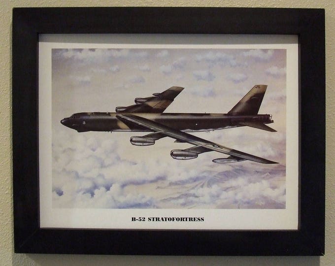 14 1/2" X 18 1/2" Black Framed Artprint ( 12" X 16" image size) of a Boeing B-52 Stratofortress over the sands of Iraq during Desert Storm.