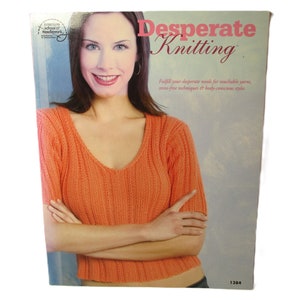 May include: A book titled "Desperate Knitting" with a woman wearing a peach-colored knitted sweater on the cover. The book cover text reads "Fulfill your desperate needs for touchable yarns, stress-free techniques & body-conscious styles".