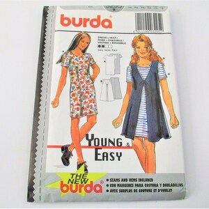 May include: Burda sewing pattern for a dress or vest. The pattern is for young and easy sewing. The pattern includes seams and hems. The pattern is illustrated with two girls wearing the finished garments. The pattern is labeled "The New Burda".