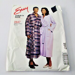 May include: A sewing pattern for a robe, with a plaid robe on the left and a solid purple robe on the right. The pattern number is 2847 and the size is B (L-XL).