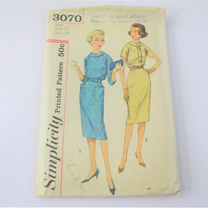 May include: Vintage Simplicity sewing pattern 3070 for a dress with short sleeves and a contrasting belt. The pattern is for size 14, bust 34 and costs 50 cents.