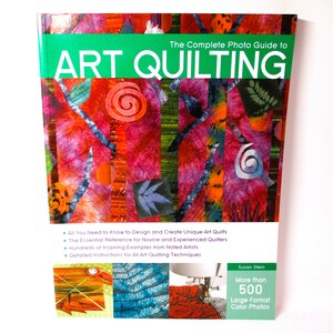 May include: The Complete Photo Guide to Art Quilting book cover features a colorful abstract quilt design with a green title bar. The book includes over 500 large format color photos and detailed instructions for all art quilting techniques.
