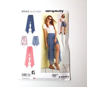 May include: Simplicity sewing pattern number 8343 for a skirt with a high-low hemline. The pattern includes four different skirt styles, including a blue and white patterned skirt, a pink skirt, and a blue skirt with a high slit. The pattern is for sizes H5 to H5.