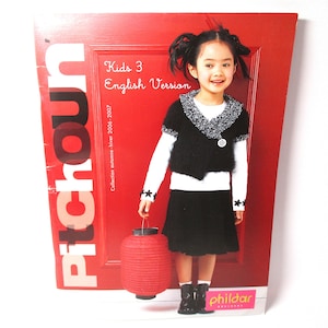 May include: A red magazine cover with the title "Pitchoun" and the text "Kids 3 English Version Collection Automne - Hiver 2006-2007". A young girl is wearing a black sweater and a black skirt, holding a red lantern.