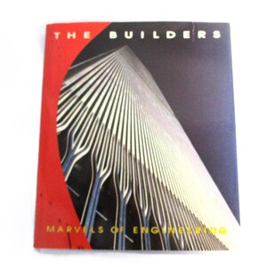 May include: A red and black book cover with the title "The Builders" and the text "Marvels of Engineering". The cover features a photograph of a tall building with a grid pattern.