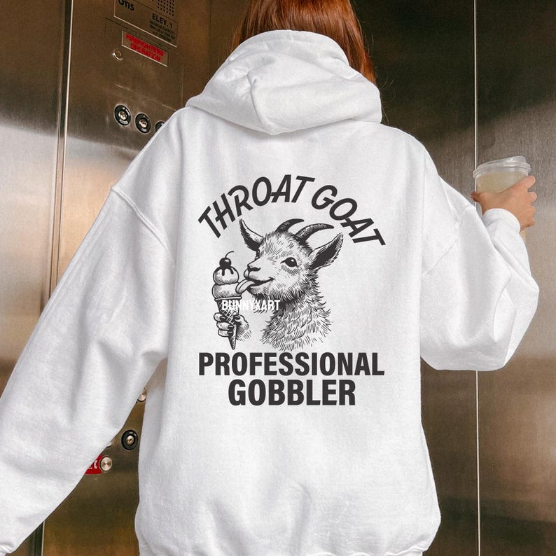 May include: White hoodie with a black graphic of a goat eating an ice cream cone. The text on the hoodie says "Throat Goat Professional Gobbler".
