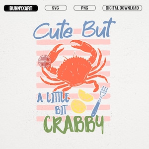 May include: A digital design featuring a cartoon crab in orange, with the text "Cute But A Little Bit Crabby". The design includes lemon slices and a fork, set against a background of pink and white stripes. The design is available as a digital download.