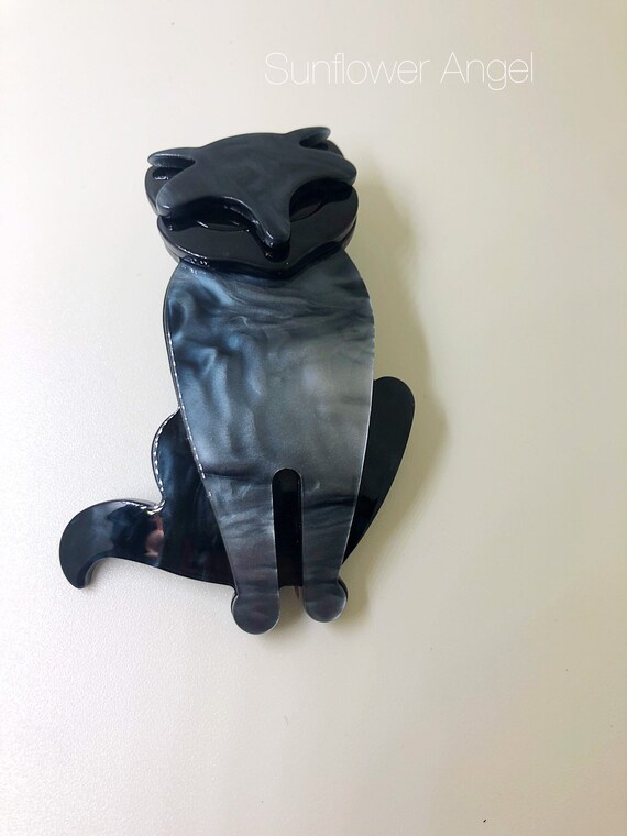 Art Deco 3D cat brooch. Grey and black swirl shimmer, with black eyes and ears.