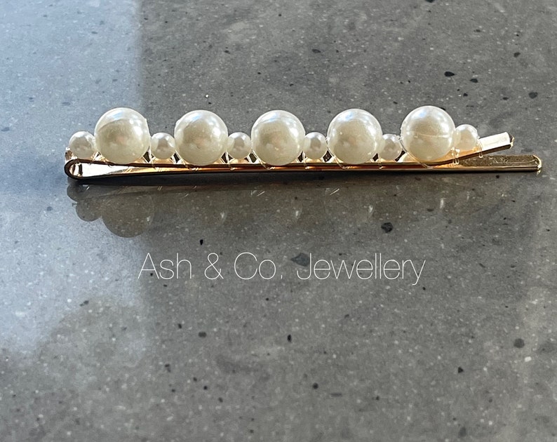 Stunning pearl hair slides. You will receive 2 hair slides, in gold, black or silver. Gold