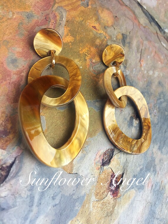 Acrylic, honey earrings. In marble shimmer effect, studs for pierced ears.