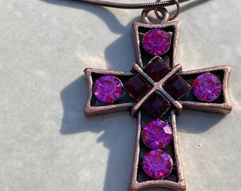 Copper based crystal cross, with square cerise and red crystals.