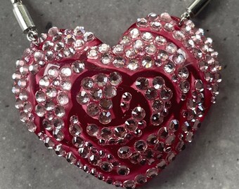 Pink acrylic crystal 2D heart necklace. On a silver chain.