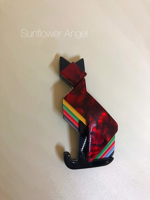 Art deco style, marbled effect acrylic, cat brooch. In red, black and multi coloured.