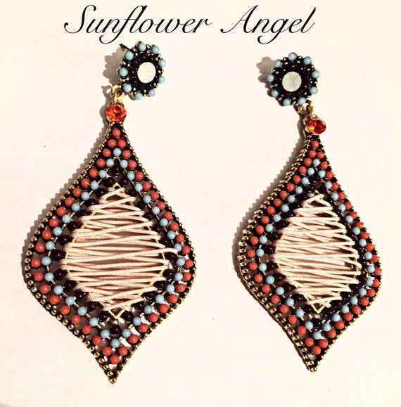 Stunning teardrop persian style earrings, with a beaded surround, and cord centre, on a vintage alloy gold base.