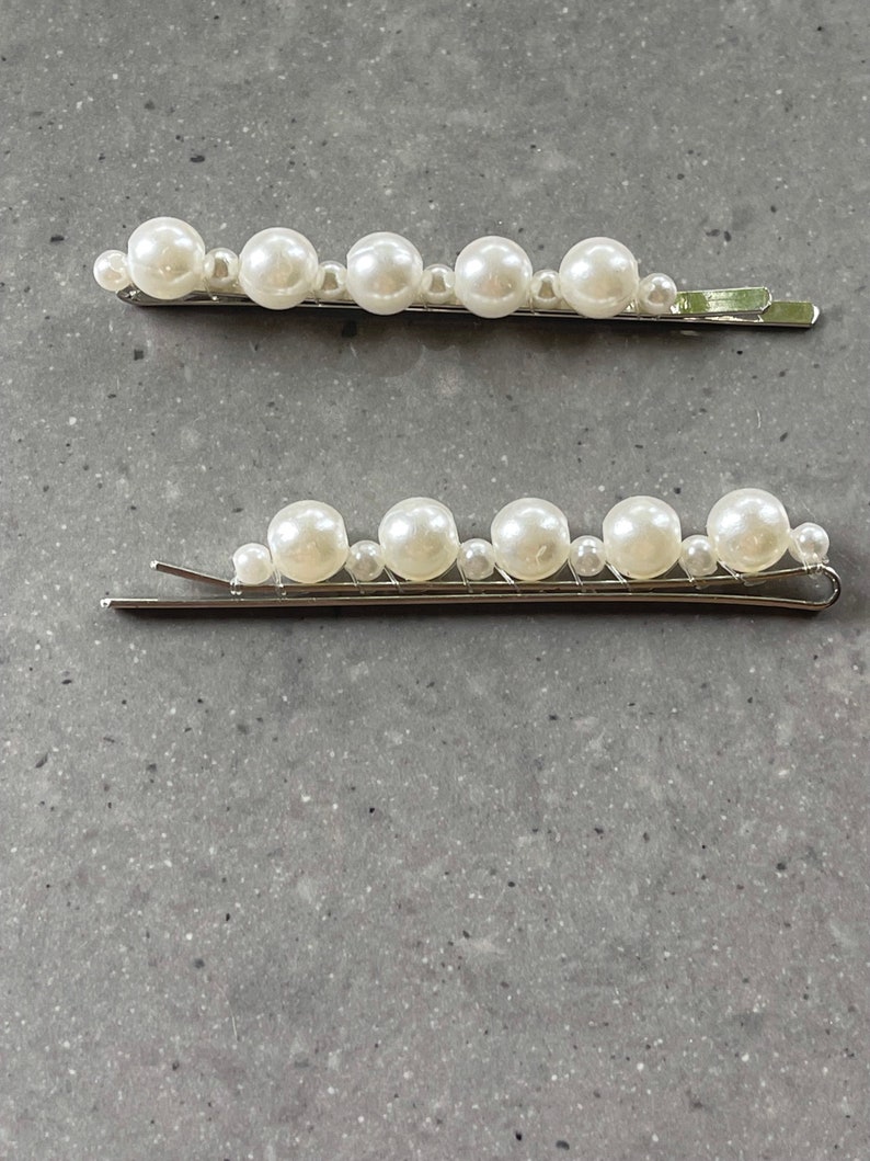 Stunning pearl hair slides. You will receive 2 hair slides, in gold, black or silver. Silver