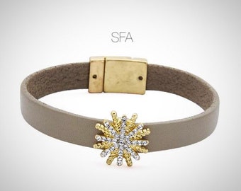 Lagenlook style. Taupe leather bracelet with gold and diamanté charm.