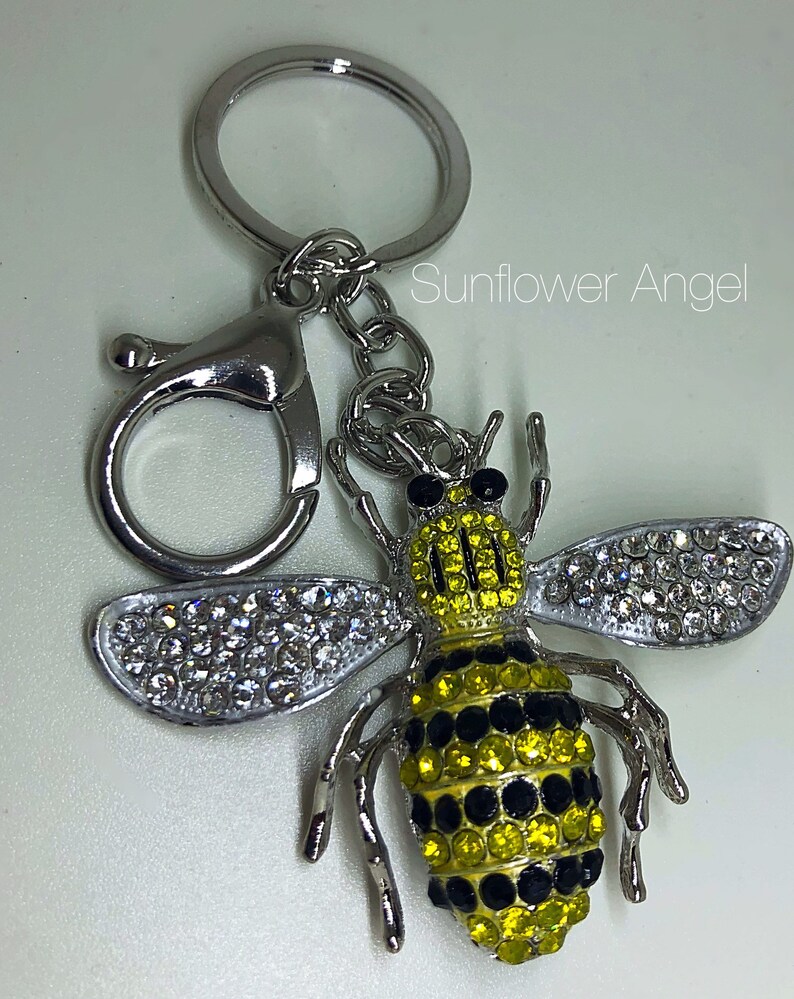 in silver with ring and bag clip. Large bumble Queen bee diamante keyring or bag charm
