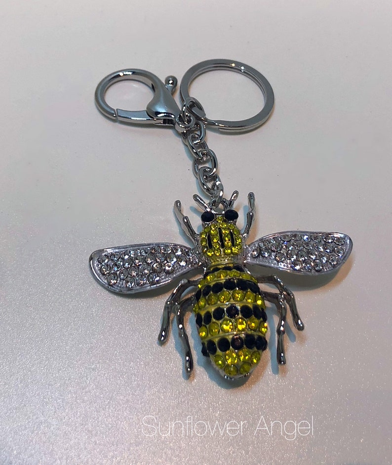 in silver with ring and bag clip. Large bumble Queen bee diamante keyring or bag charm