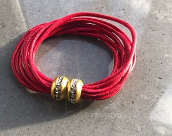 Red cord multi thread bracelet, polished brass diamante bezel magnetic magnetic fastener