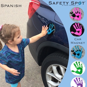 May include: A set of four car magnets with a handprint design and the text "Espacio Seguro" in Spanish, meaning "Safe Space". The magnets are in blue, pink, green, and purple.