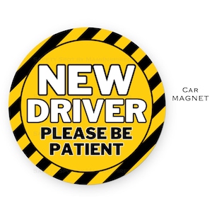 May include: Yellow and black round car magnet with the text "NEW DRIVER PLEASE BE PATIENT" in white letters.