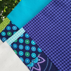 Quilted modern white clergy stole with pieced teal and purple fabric for wedding, funeral, or baptism for priests, ministers, pastors