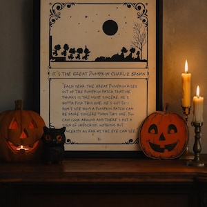 May include: A framed print with the text "IT'S THE GREAT PUMPKIN CHARLIE BROWN" and a scene of characters. Two lit jack-o'-lanterns and a small owl figurine flank the print. Two lit candles are in the background.