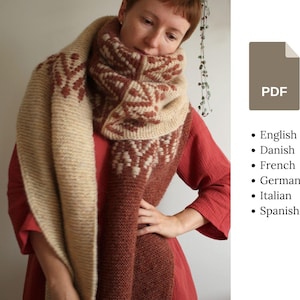 Può includere: Una sciarpa di lana marrone e crema con un motivo geometrico. La sciarpa è indossata da una persona che indossa un vestito rosso.