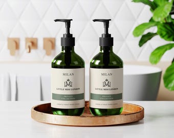 May include: Two green glass bottles with black pump tops and white labels. The labels read "Milan Little Miss London Private Collection Hand & Toilet Bar Liquid".