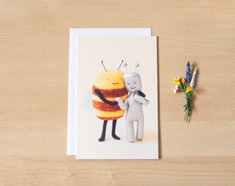One blank greeting card of Bee and Robot hugging