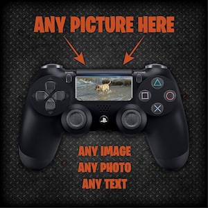 May include: A black PlayStation 4 controller with a screen displaying a picture of a dog on a beach. The text "ANY PICTURE HERE" is above the controller, and the text "ANY IMAGE ANY PHOTO ANY TEXT" is below the controller.